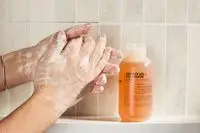 Person tests Le Labo Hinoki Shower Gel on their hands