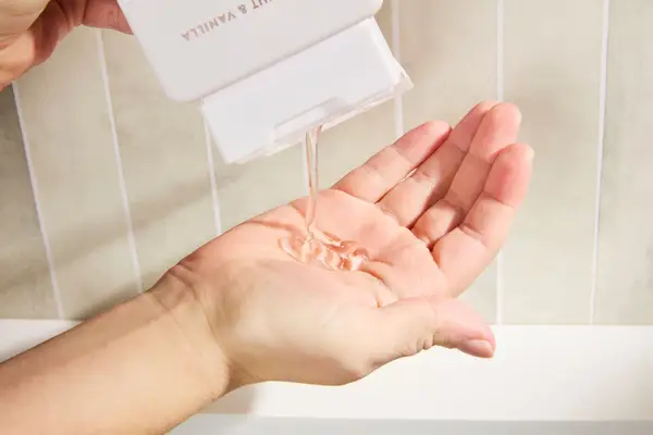 Person dispenses Native Body Wash into their hand