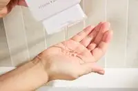 Person dispenses Native Body Wash into their hand
