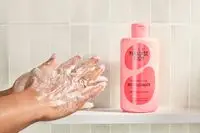 Person tests Isle of Paradise Confidently Clear Body Cleanser on their hands