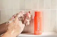 Person tests Kosas Good Body Skin AHA + Enzyme Exfoliating Body Wash