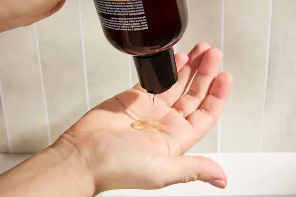 Person dispenses Maude pH-Balanced Body Wash and Bubble Bath into their hand