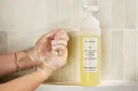 Person tests Naturium The Glow Getter Multi-Oil Hydrating Body Wash on their hands