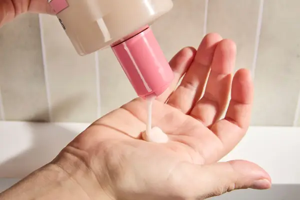 Person dispenses Soap & Glory Original Pink Clean on Me Clarifying Body Wash into their hand