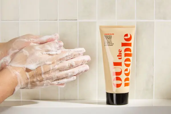 Person tests OUI the People Clean Slate Lactic Acid Smoothing Body Wash