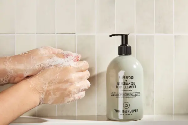 Person tests Youth To The People Superfood + Niacinamide Body Cleanser