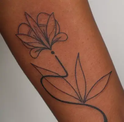 abstract inner arm rose tattoo