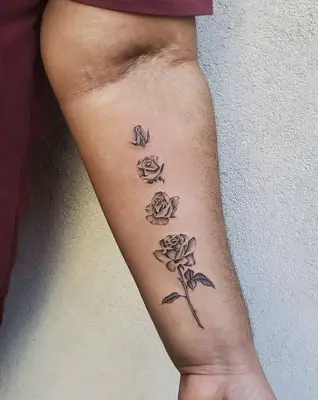 evolution of a rose tattoo on forearm