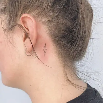Lightning Bolt behind the ear tattoo