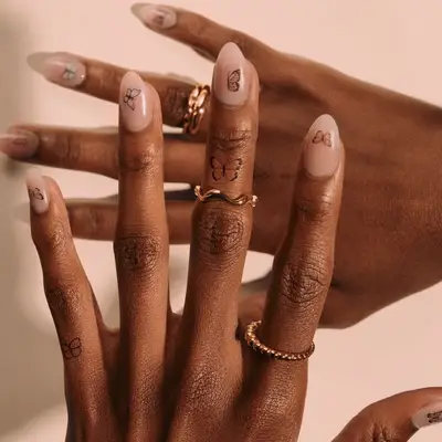 Butterfly tattoo with natural details and leaves