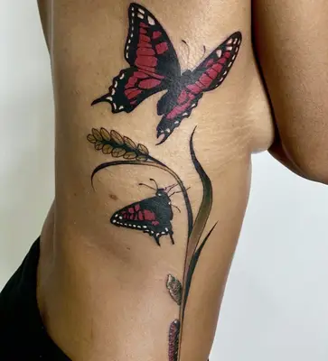 Dynamic blue butterfly tattoo on forearm
