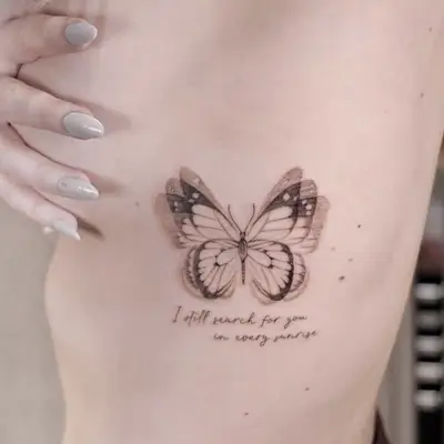 Close up of a blue butterfly tattoo with shading