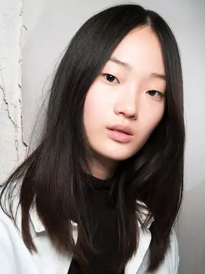 asian woman with little makeup on