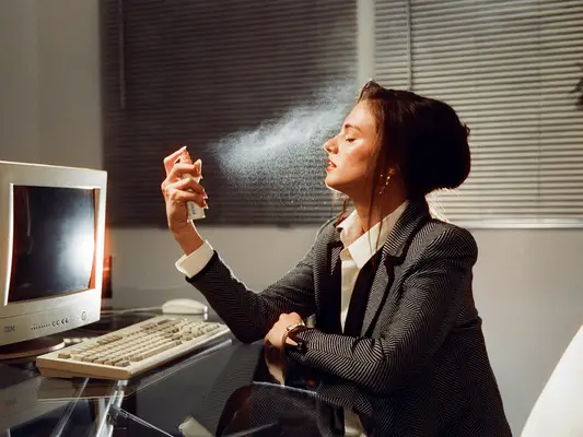 Woman using Vacation Face Mist 