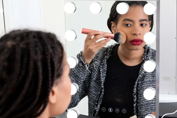 woman applying Mented Cosmetics Skin Silk Loose Setting Powder to face