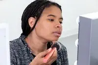 woman beginning to add Mented Cosmetics Skin Silk Loose Setting Powder to face