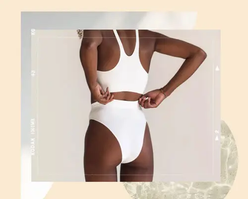 woman pulling in white high-waisted briefs