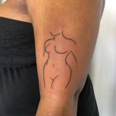 Arm Tattoo of Female Figure on upper arm