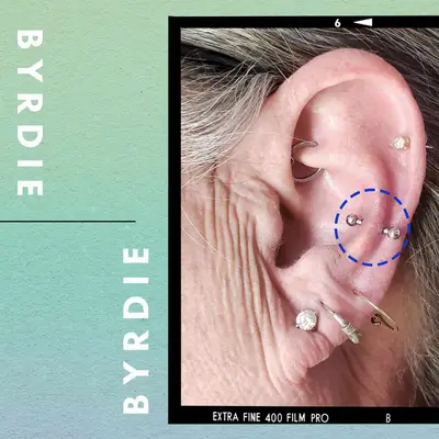 Ear with a snug piercing and custom illustration