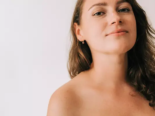 A fresh-faced woman looking at the camera