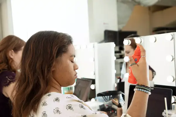 Person spraying their face with Tower 28 SOS Daily Rescue Facial Spray