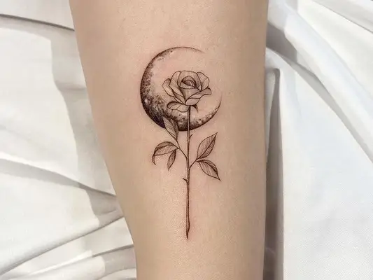 crescent moon and long stem rose tattoo