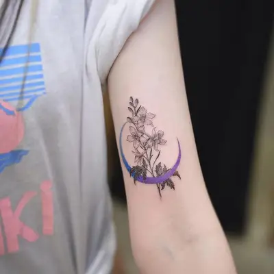 crescent moon with birth flower tattoo