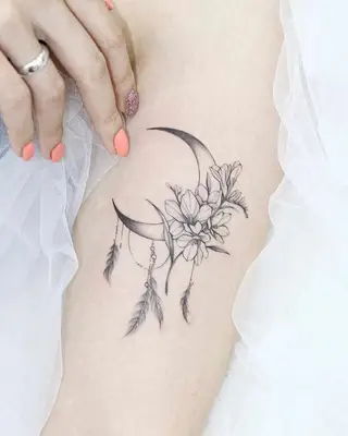 feathers and flowers with crescent moon