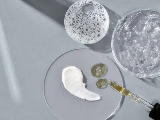 a variety of skincare ingredients in petri dishes