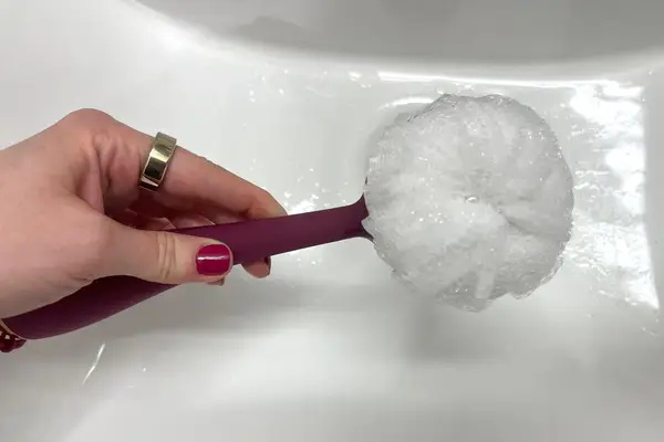 The PMD Clean Body Smart Body Cleansing Device is lathered with soap