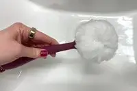 The PMD Clean Body Smart Body Cleansing Device is lathered with soap