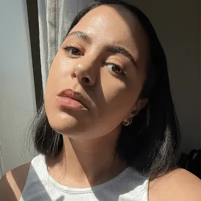 woman wearing the Glow Recipe Watermelon Glow Dew Balm