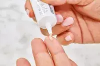 A person applies Dermalogica Awaken Peptide Eye Gel