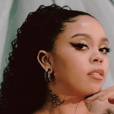 Woman with a tattoo coloring in her inner ear lobe 