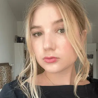 MYM Beauty editor wearing Merit The Uniform tinted sunscreen