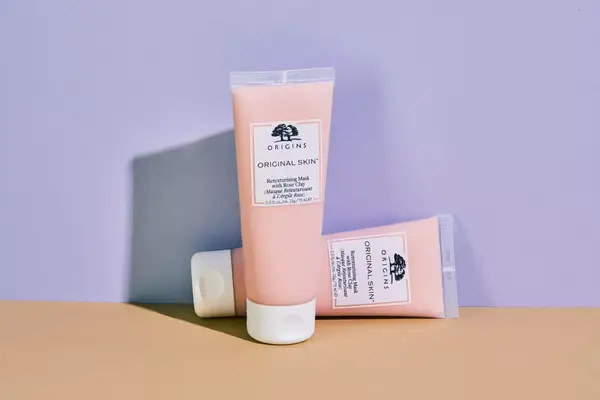 Person applying a skincare product to their nose