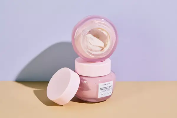 Person applying a skincare product to their forehead