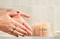 Person tests Osea Salts of the Earth Body Scrub on their hands