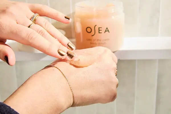 Person tests Osea Salts of the Earth Body Scrub on their hand