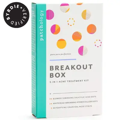 Person wearing Formula 10.0.6 Down To the Pore Strips Pack on their face while looking at box