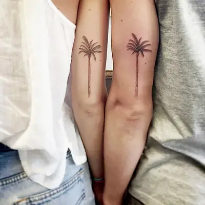 Matching palm tree tattoos
