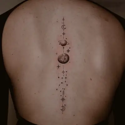 Person with a astrology-inspire constellation mandala back tattoo