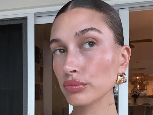 Hailey Bieber wearing large gold earrings