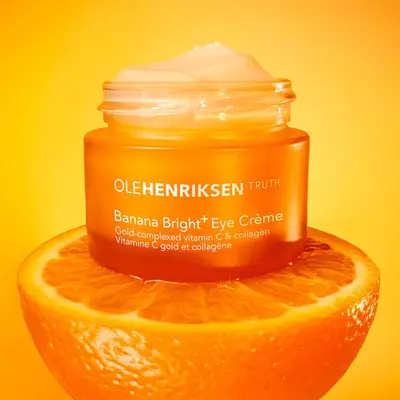 ole henriksen banana bright eye cream on orange background