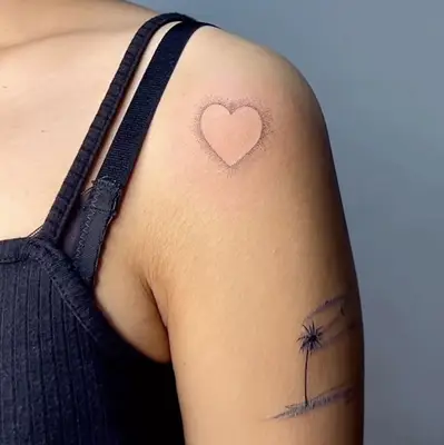 outline of a heart tattoo on woman