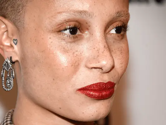 Model Adwoa Aboah with heart tattoo on ear
