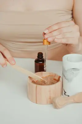 closeup mixing clay and essential oil