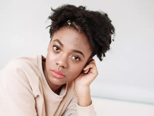 woman with hand on head