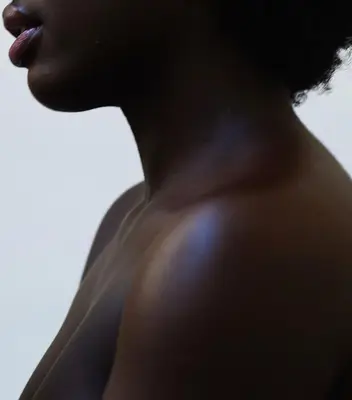 A nude dark-skinned woman 