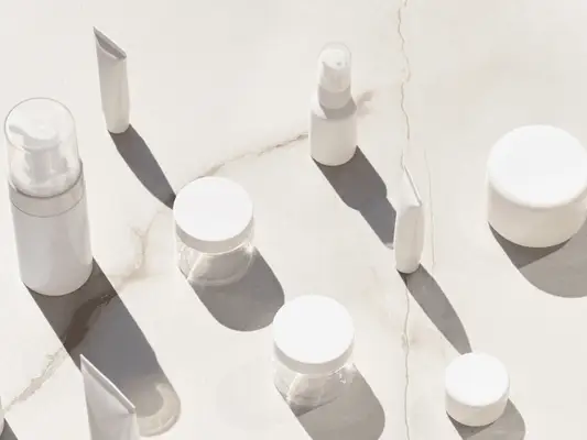 Image of white tubes, jars and bottles of moisturizer